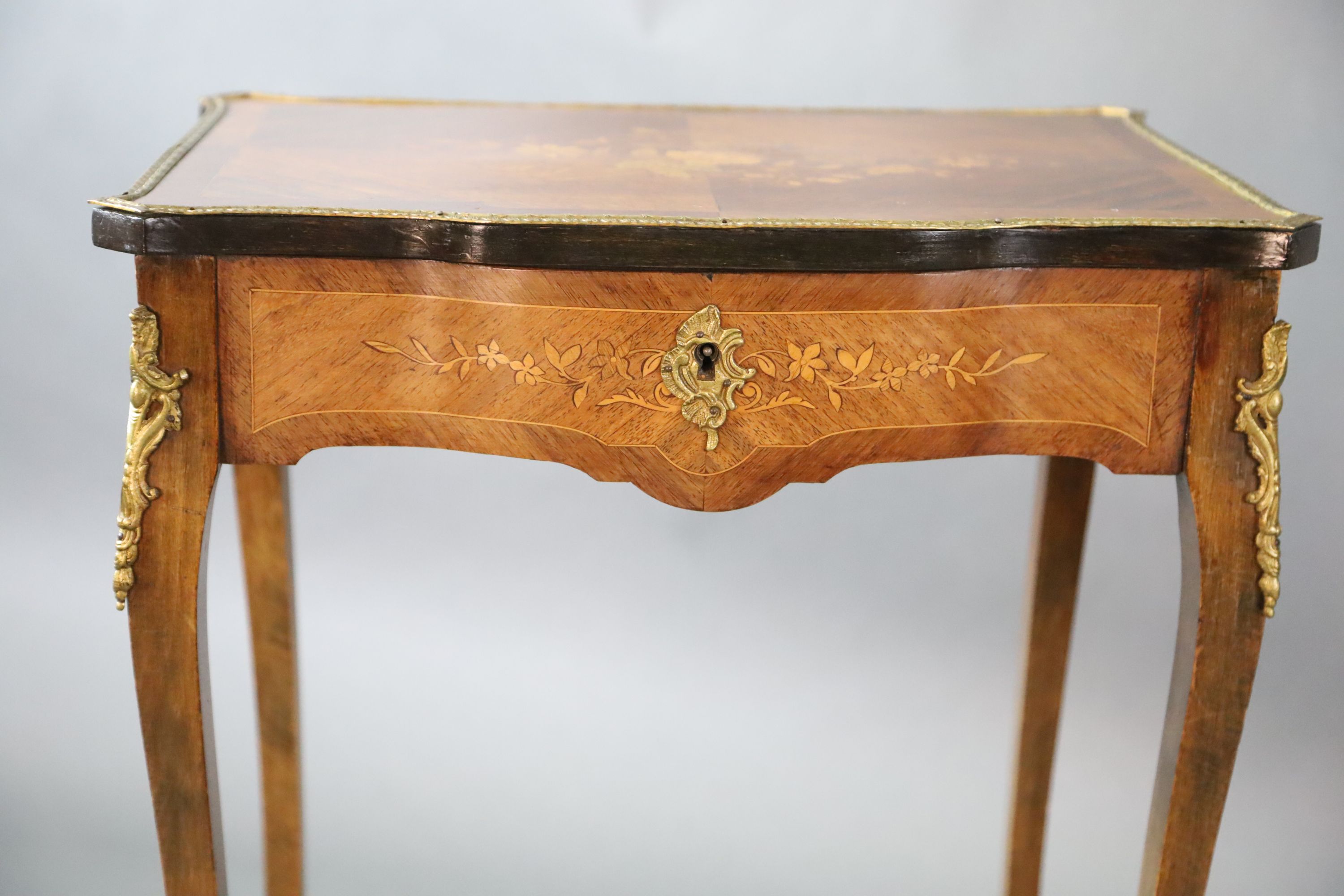 A pair of Louis XVI style ormolu mounted marquetry work tables, W.1ft 9in. D.1ft 3in. H.2ft 6in.